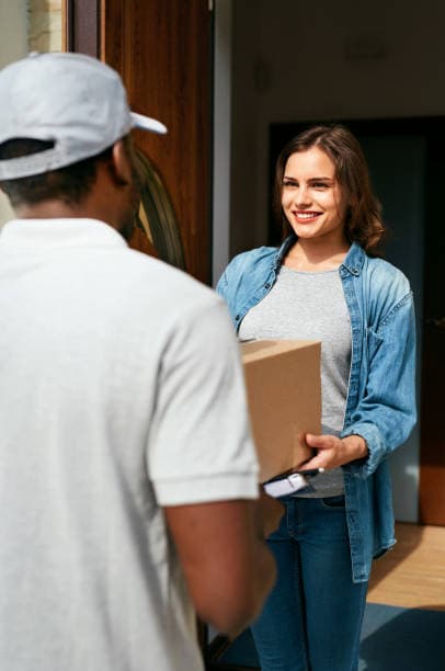 Doorstep delivery - customer receiving a package from a courier